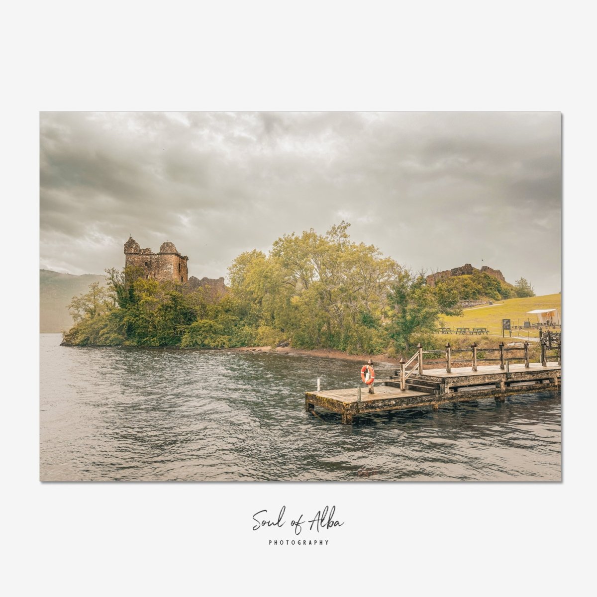 Urquhart Castle ruins on the shores of Loch Ness, with an old jetty in the foreground and a dramatic Highland sky — Soul of Alba Photography fine art print