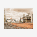 Fine art sepia print of Bo’ness Train Station by Soul of Alba, featuring the historic signal box and Victorian lattice footbridge in a vintage heritage style.