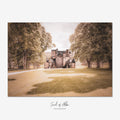 Fine art photograph of Castle Fraser in Aberdeenshire, Scotland, viewed along a tree-lined avenue leading to the historic Scottish castle.