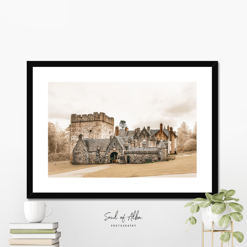 Framed print of the Historic Drum Castle in Aberdeenshire, Scotland, featuring its medieval tower house, stone entrance archway, and traditional Scottish architecture.
