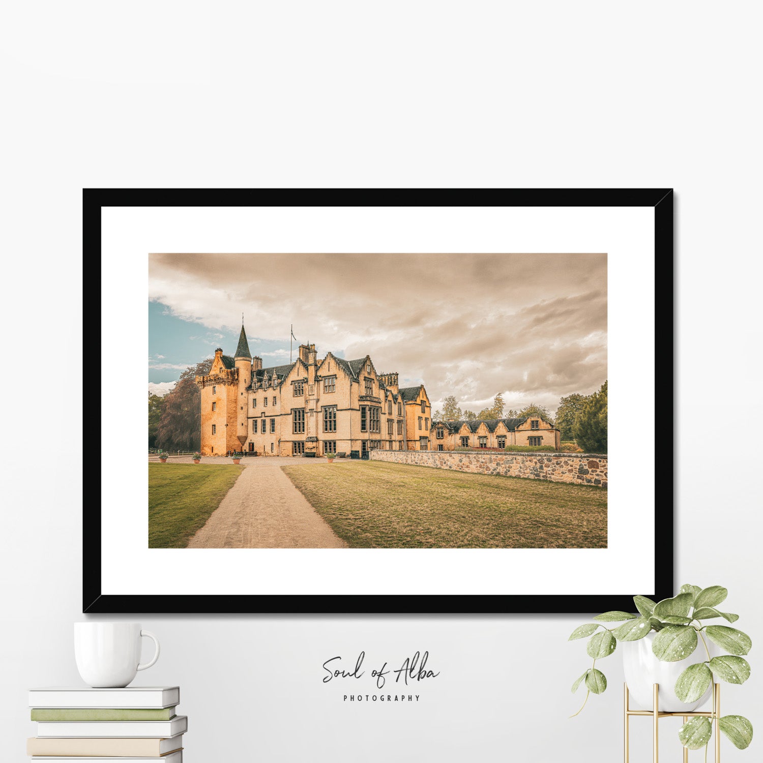 Framed fine art print featuring a panoramic side view of Brodie Castle in Moray, Scotland, displayed in a contemporary home.