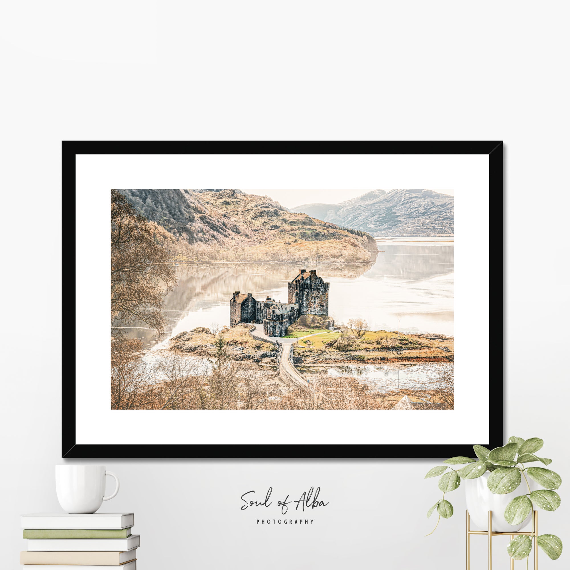 Framed fine art print of Eilean Donan Castle displayed in a contemporary home setting.
