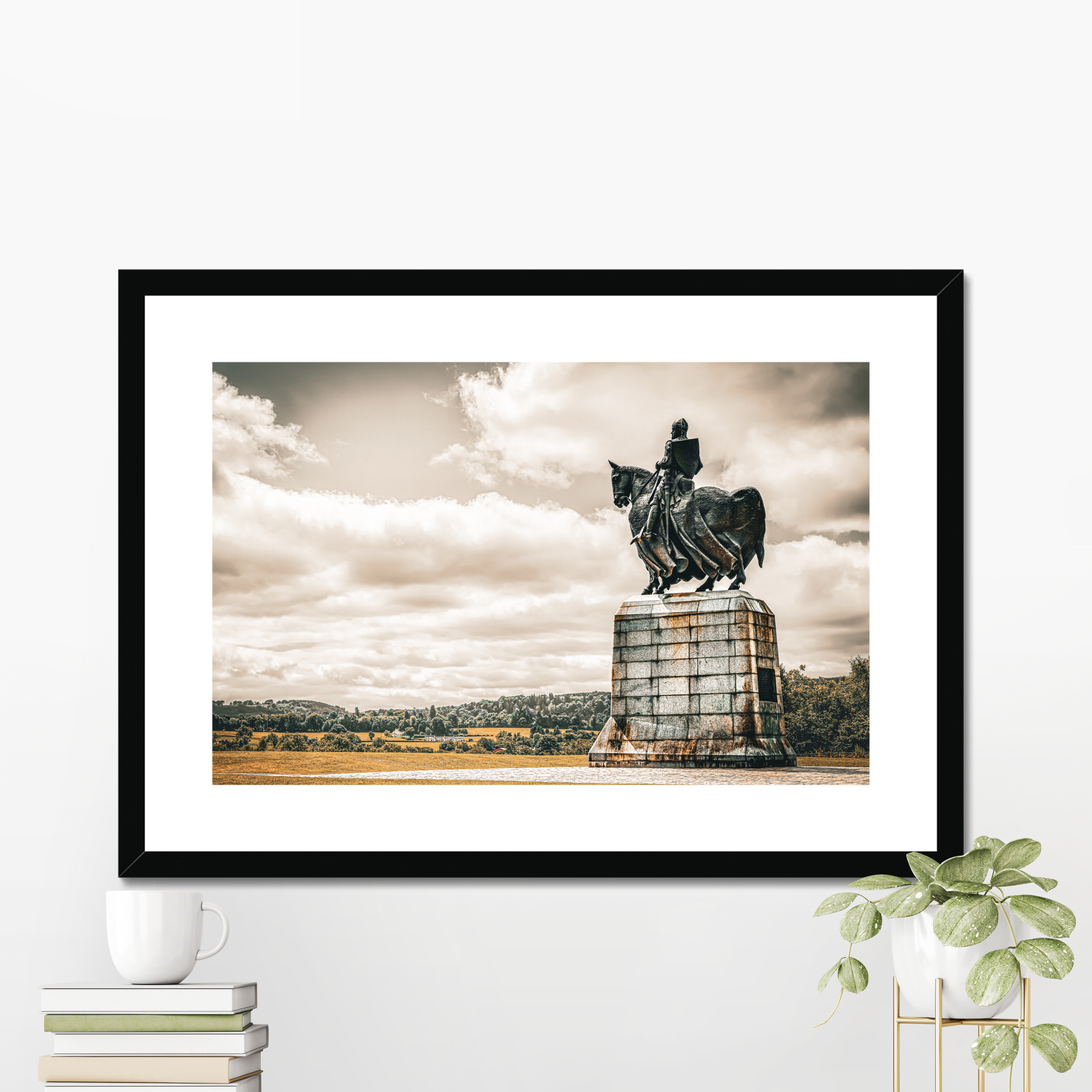 Robert the Bruce fine art photography print displayed in a black picture frame with a white mount. Styled as a powerful piece of Scottish heritage wall decor in a bright modern interior setting.