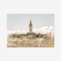 Fine art landscape photograph of the University of Glasgow’s Gothic spire rising above the treetops of the West End. The historic sandstone architecture is captured in warm, sun-drenched tones under a bright, cloud-filled sky.