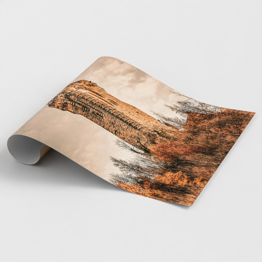 Close-up view of a rolled fine art print featuring the National Wallace Monument showcasing the rich textures warm earthy tones and intricate details of the Scottish landmark.