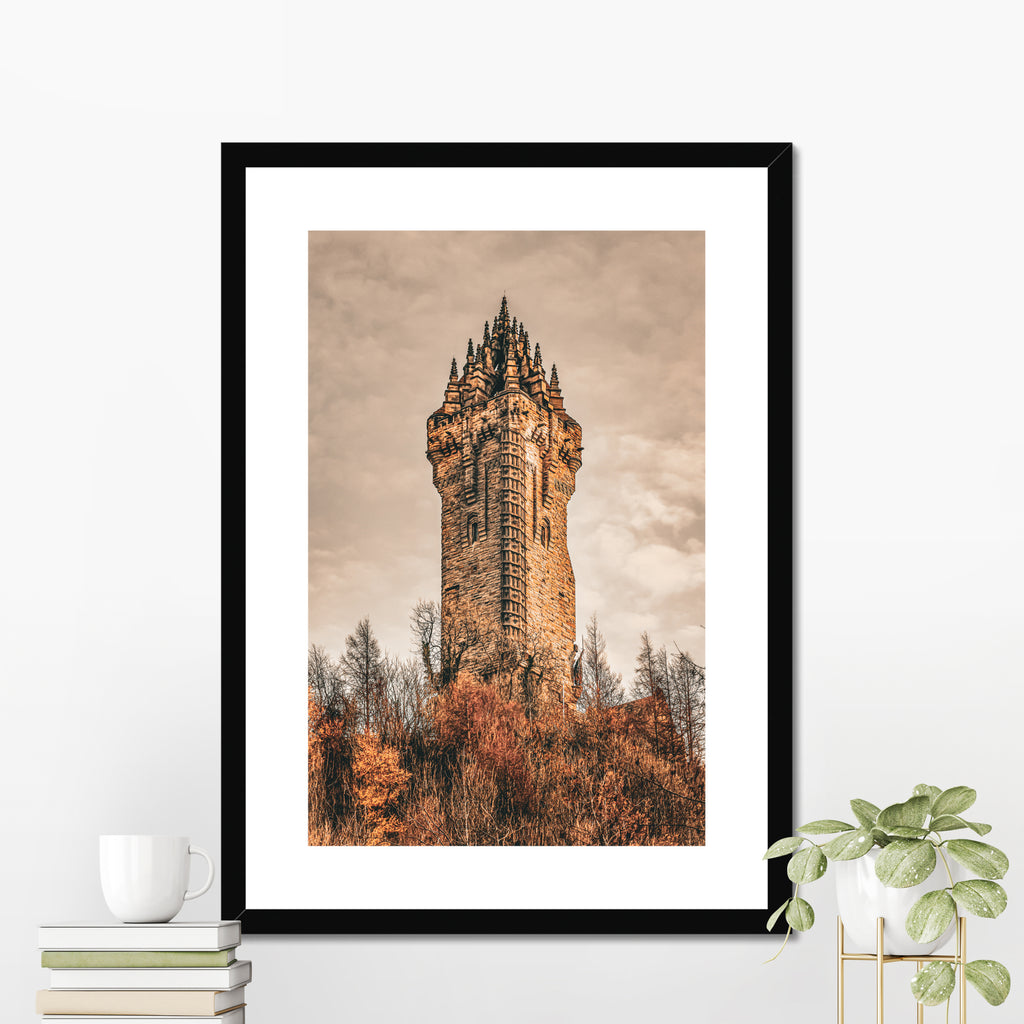 National Wallace Monument photography print displayed in a black picture frame styled as elegant wall decor in a modern interior setting.