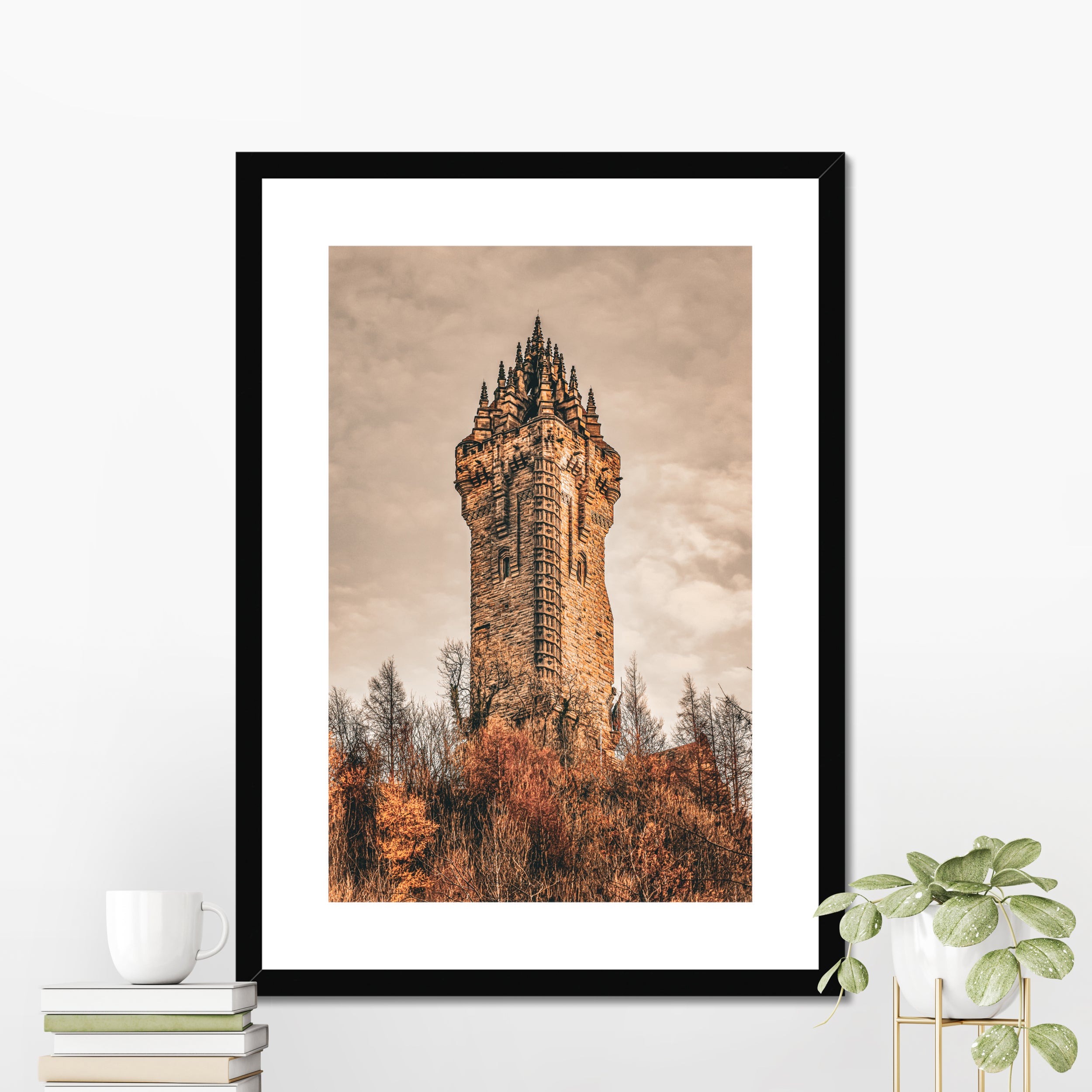 National Wallace Monument photography print displayed in a black picture frame styled as elegant wall decor in a modern interior setting.