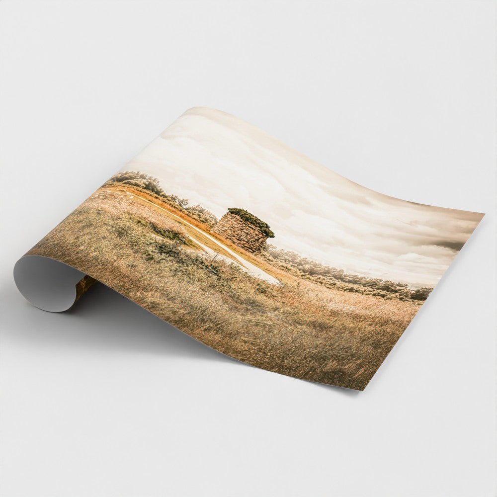 Rolled Print of Memorial cairn standing on Culloden Battlefield near Inverness, Scotland, beneath dramatic clouds and golden light.
